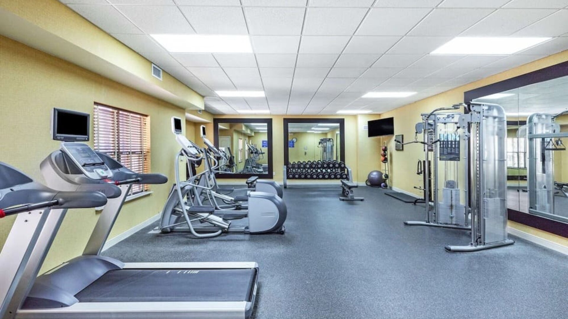 Fitness center at Homewood Suites By Hilton Shreveport.