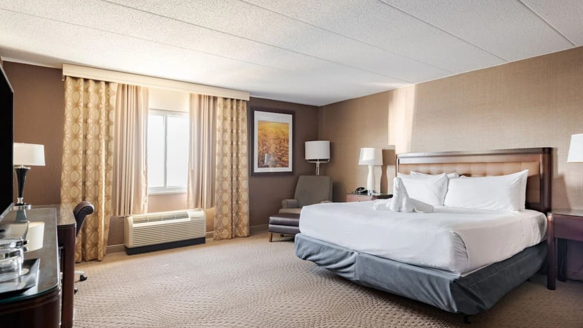 Bright and spacious day use room with work desk at Wyndham Omaha.