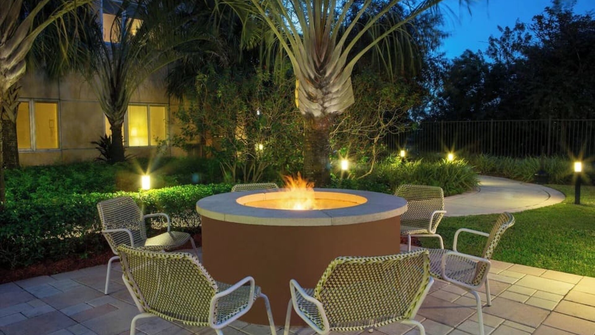 Outdoor lounge seating and fire pit at Element Miami International Airport.