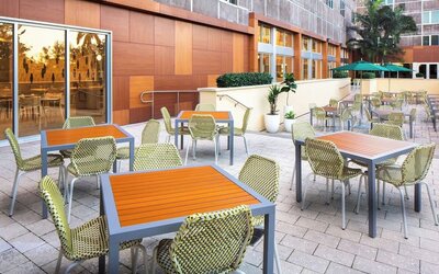 Outdoor dining area at Element Miami International Airport.