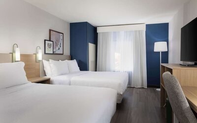 Day use room with queen beds and tv at Spark By Hilton Guelph.