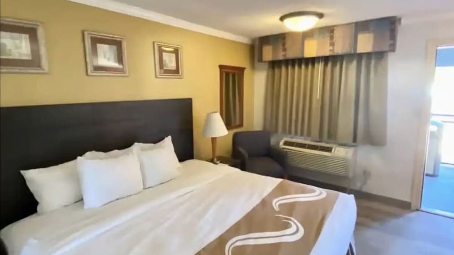 Comfortable king room at Hibiscus Inn & Suites.