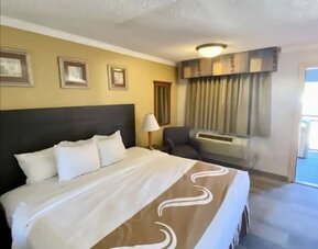 Comfortable king room at Hibiscus Inn & Suites.