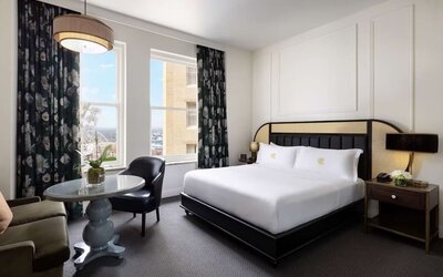 Delux king room with natural light at The Candler Hotel Atlanta, Curio Collection By Hilton.