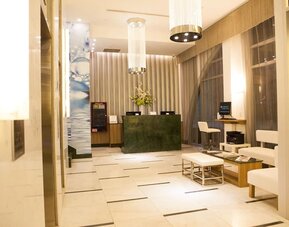 Hotel lobby and workspace at Wyndham Garden Brooklyn Sunset Park.