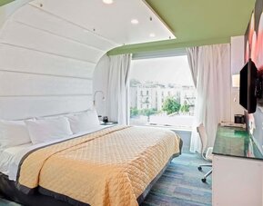 King room with comfortable bed and work desk at Wyndham Garden Brooklyn Sunset Park.