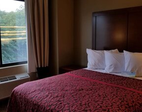 Day use room with large window and private bathroom at Days Inn By Wyndham Brooklyn Marine Park.