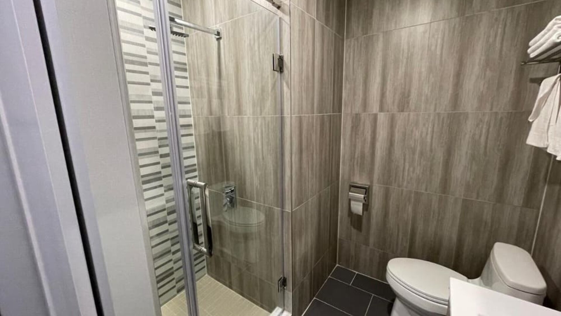 Private bathroom with shower at King Hotel Brooklyn.