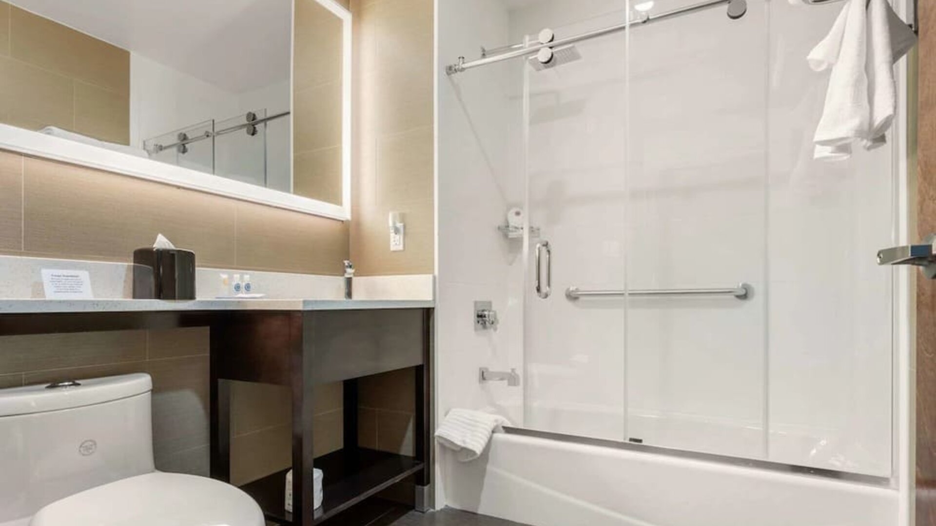 Private guest bathroom with free toiletries at Comfort Inn Prospect Park-Brooklyn.