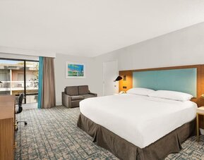 Day use room with work desk and natural light at The Anaheim Hotel.