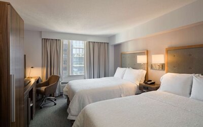 Day use twin room with work desk, large windows and private bathroom at Hampton Inn Manhattan Chelsea.