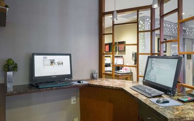 Business center with computers and printer at Hampton Inn Manhattan Chelsea.