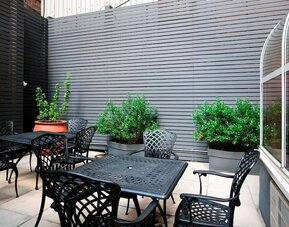Outdoor seating at Hampton Inn Manhattan - Madison Square Garden.