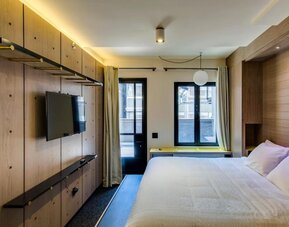 King room with large windows, work desk and private bathroom at Hotel Shocard NYC.