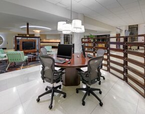 Business center with computers, printer and ergonomic chairs at Sheraton Miami Airport Hotel.