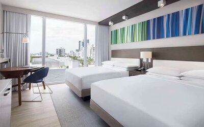 Day use twin room with floor to ceiling windows, work desk and private bathroom at Hyatt Centric Miami South Beach.