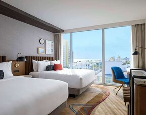 Day use twin room with floor to ceiling windows, work desk and private bathroom at Hyatt Centric Miami South Beach.