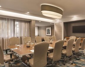 Professional meeting room with comfortable seating at Hilton Miami Airport Blue Lagoon.