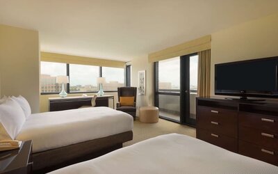 Day use twin room with work desk, balcony and private bathroom at Hilton Miami Airport Blue Lagoon.