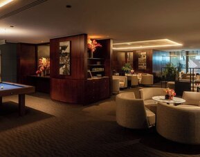 Cozy hotel bar at Sheraton Paris Charles De Gaulle Airport Hotel.