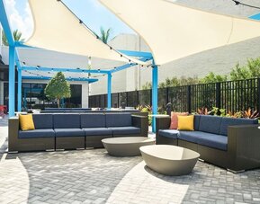 Outdoor lounge at Tru By Hilton Ft. Lauderdale Airport.