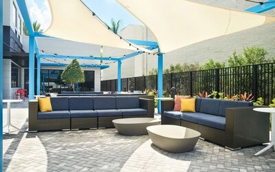 Outdoor lounge at Tru By Hilton Ft. Lauderdale Airport.