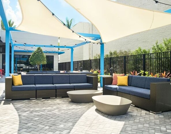 Outdoor lounge at Tru By Hilton Ft. Lauderdale Airport.