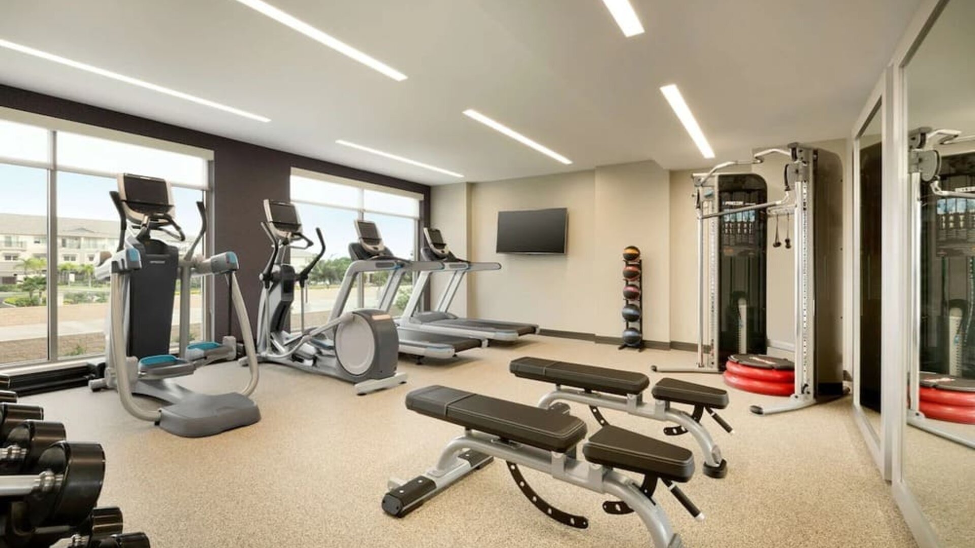 Fitness center at Embassy Suites By Hilton Oahu Kapolei.