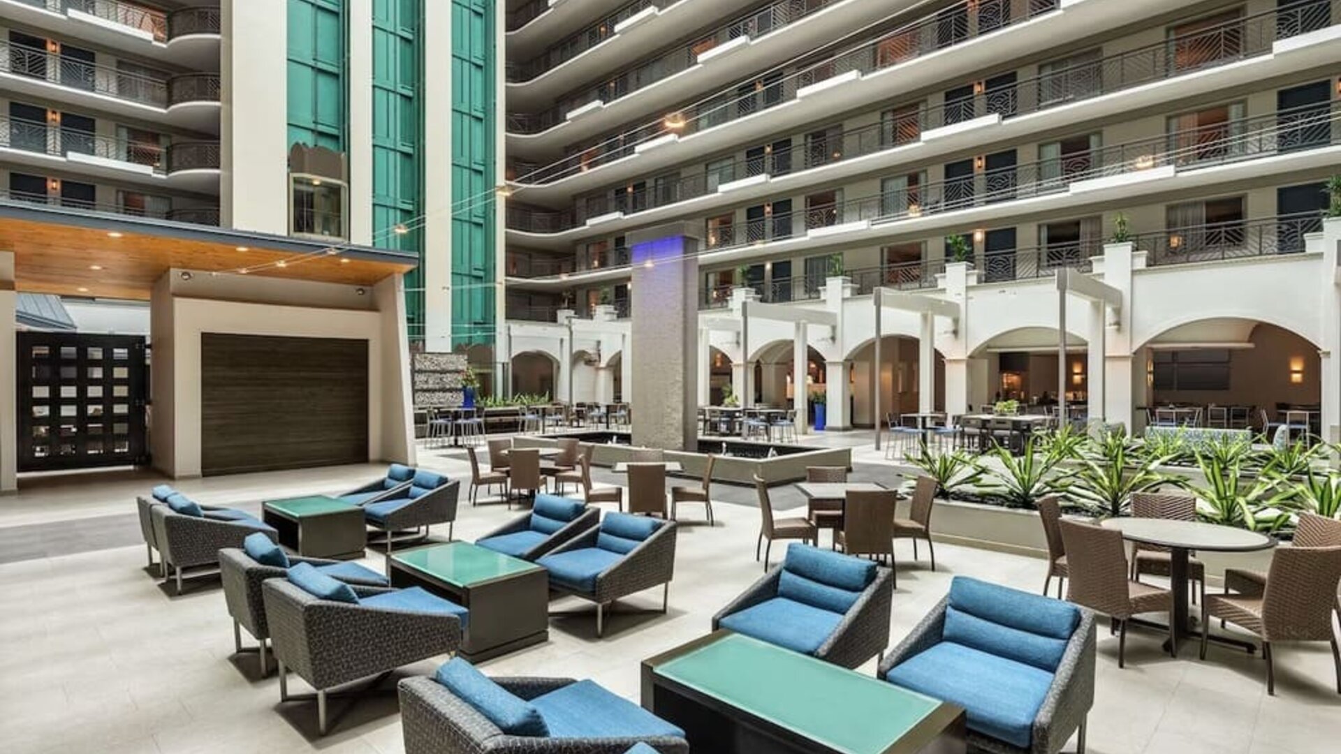 Lobby workspace with comfortable seating at Embassy Suites By Hilton Miami - International Airport.
