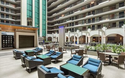 Lobby workspace with comfortable seating at Embassy Suites By Hilton Miami - International Airport.