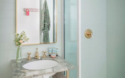 Private bathroom with shower and free toiletries at The Goodtime Hotel.