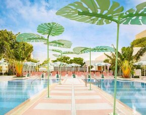 Beautiful outdoor pool with lounge chairs at The Goodtime Hotel.