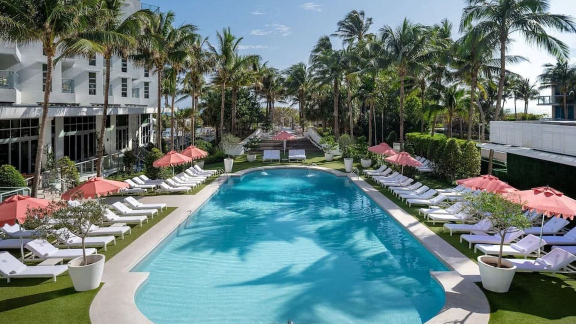 Beautiful outdoor pool with lounge chairs at Cadillac Hotel & Beach Club, Autograph Collection.