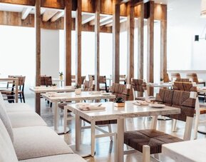 Dining room with comfortable seating, perfect for co-working at Cadillac Hotel & Beach Club, Autograph Collection.