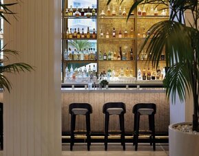 On-site bar at Cadillac Hotel & Beach Club, Autograph Collection' lobby. 