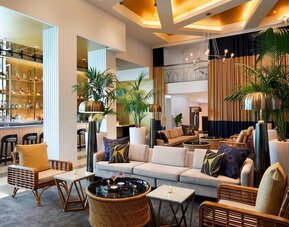 Lobby lounge area and workspace, perfect for co-working at Cadillac Hotel & Beach Club, Autograph Collection.