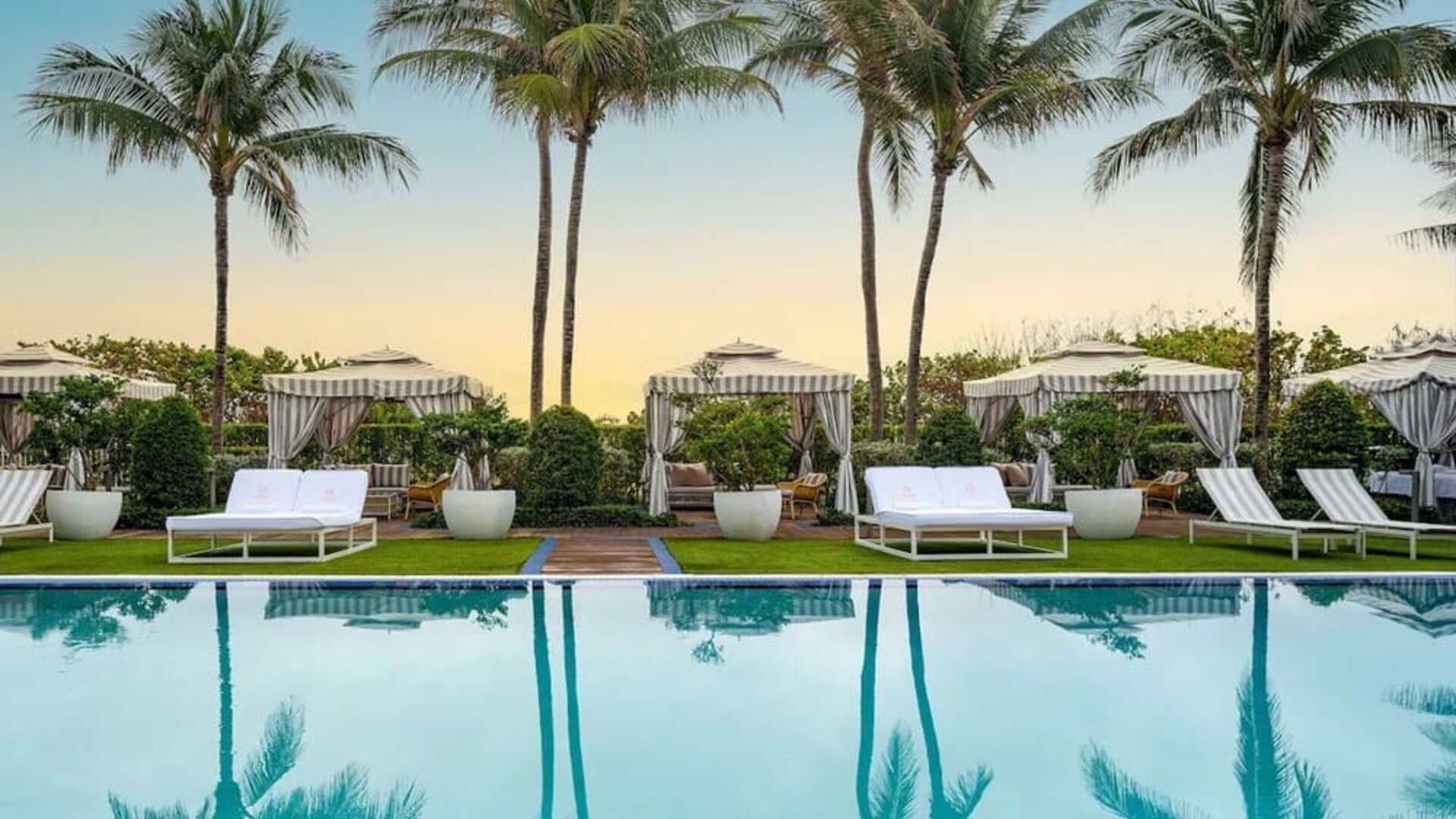Outdoor pool with lounge seating at Cadillac Hotel & Beach Club, Autograph Collection.