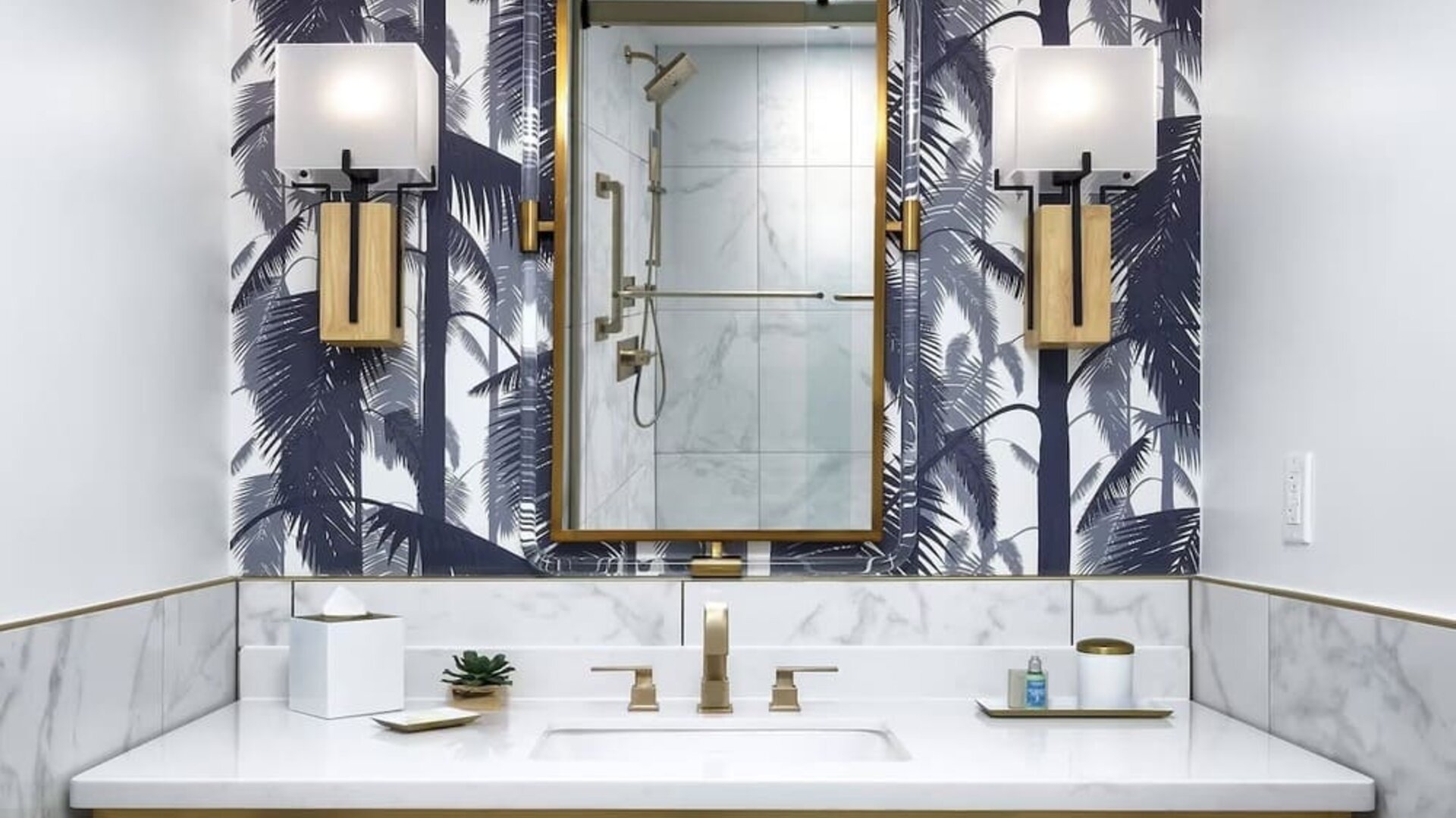 Private guest bathroom with shower and free toiletries at Cadillac Hotel & Beach Club, Autograph Collection.