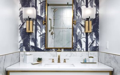 Private guest bathroom with shower and free toiletries at Cadillac Hotel & Beach Club, Autograph Collection.