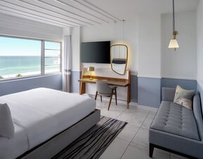 Standard day use room with queen bed, work desk and private bathroom at Cadillac Hotel & Beach Club, Autograph Collection.