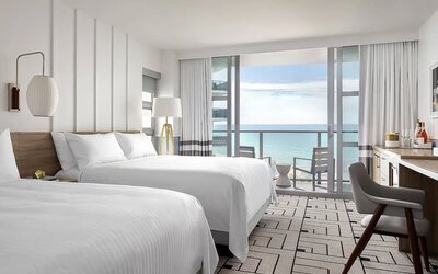 Day use twin room with work desk, balcony and private guest bathroom at Cadillac Hotel & Beach Club, Autograph Collection.