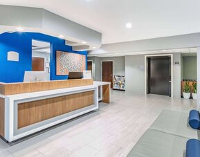 Reception desk at Microtel Inn And Suites By Wyndham Austin Airport.