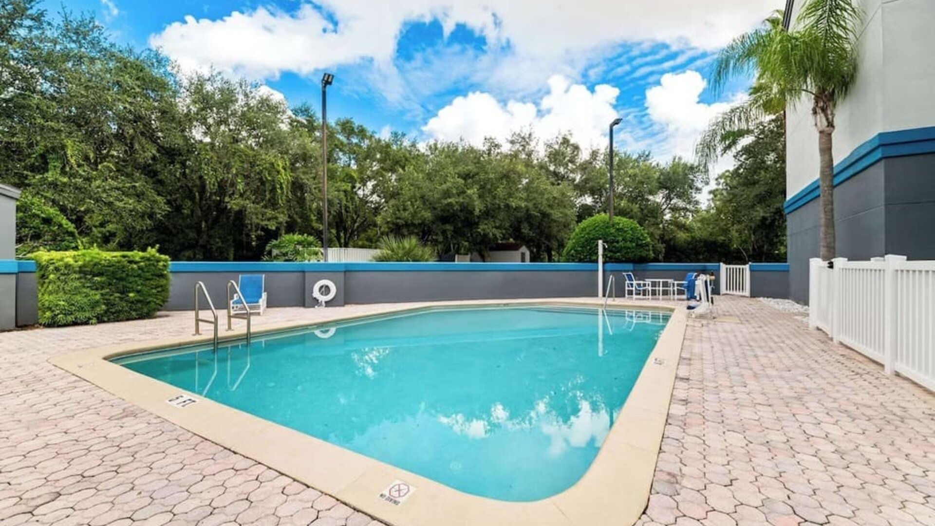 Refreshing outdoor pool at Suburban Studios Orlando - Ocoee/Winter Garden.