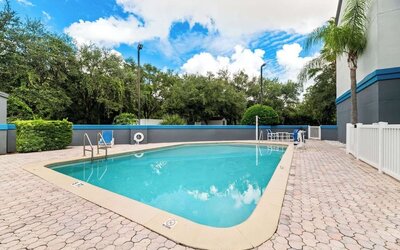 Refreshing outdoor pool at Suburban Studios Orlando - Ocoee/Winter Garden.
