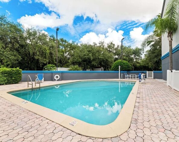 Refreshing outdoor pool at Suburban Studios Orlando - Ocoee/Winter Garden.