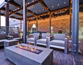 Outdoor seating at Home2 Suites By Hilton San Francisco Airport North.