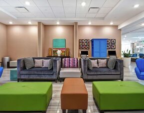 Coworking space and lounge at Home2 Suites By Hilton San Francisco Airport North.