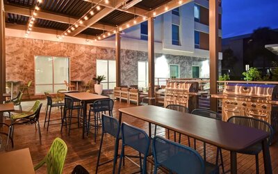 Outdoor seating at Home2 Suites By Hilton San Francisco Airport North.