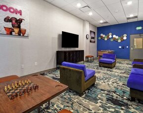 Coworking space and lounge at Home2 Suites By Hilton San Francisco Airport North.
