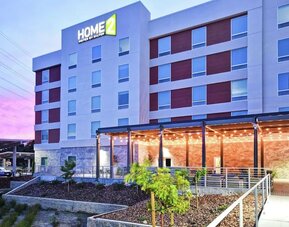 Hotel exterior at Home2 Suites By Hilton San Francisco Airport North.